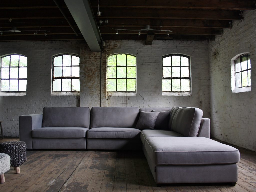 Rural corner sofa Michelle in a gray fabric with a footstool