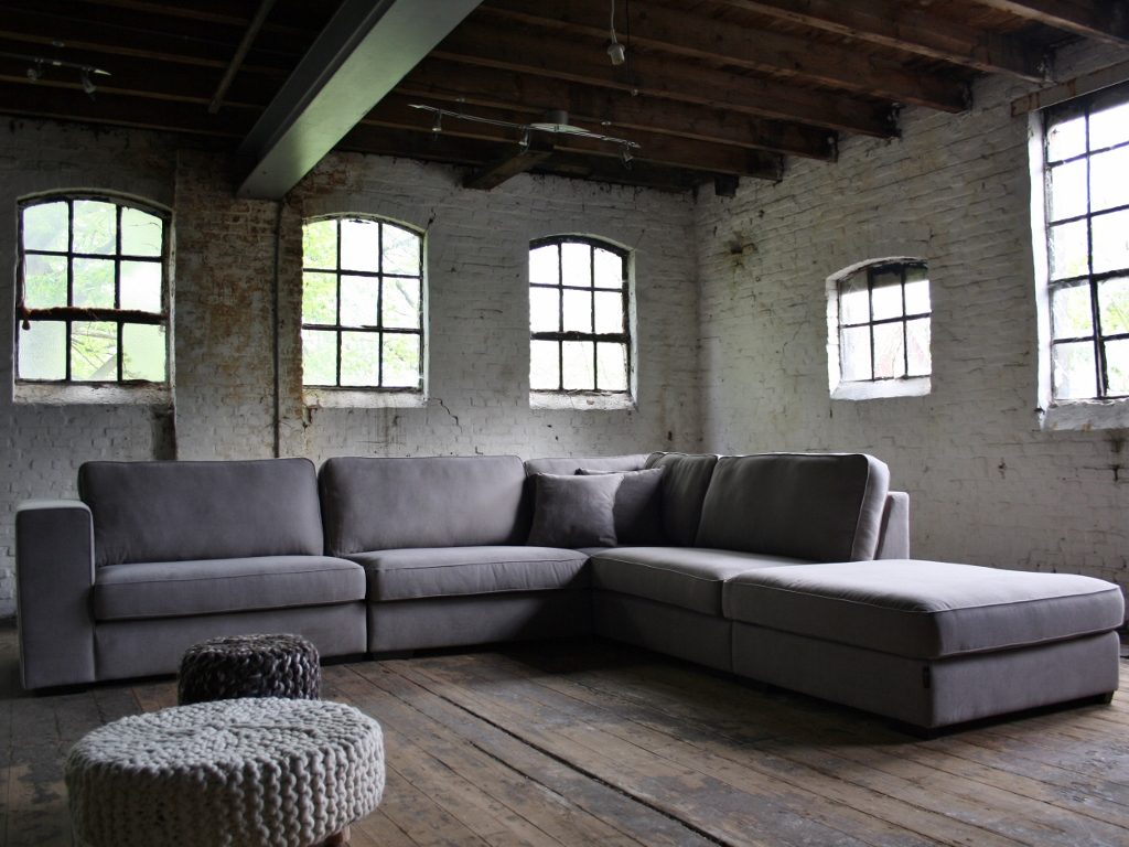 Rural corner sofa Michelle in a gray fabric with a footstool