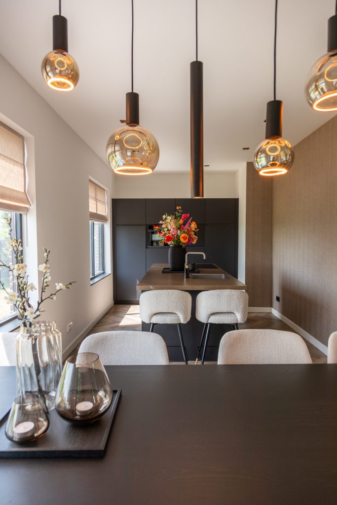 Modern kitchen with black countertop and black cabinet.