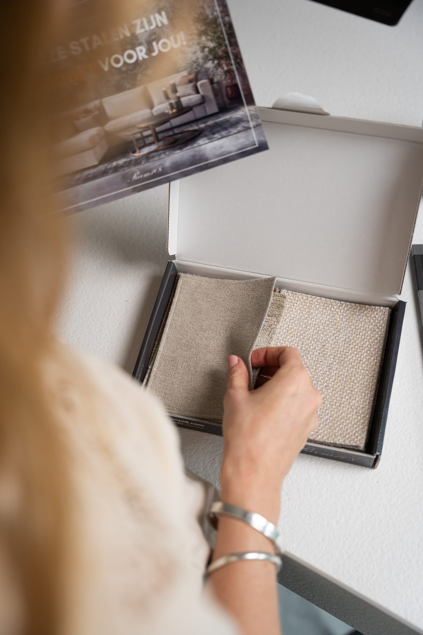 Box with fabric samples in it