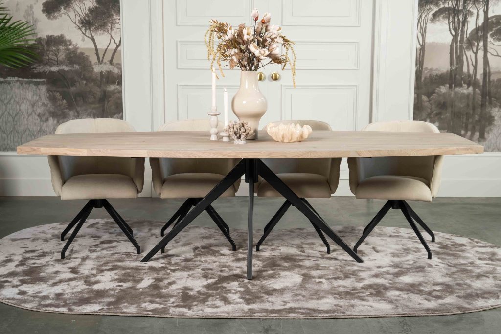 The Nice semi-oval dining table with a tapered spider leg from Room108