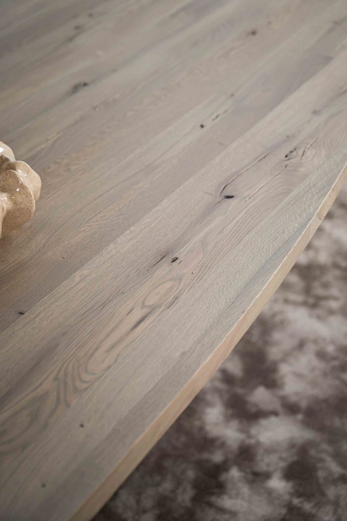 The Nice semi-oval dining table with a tapered spider leg from Room108