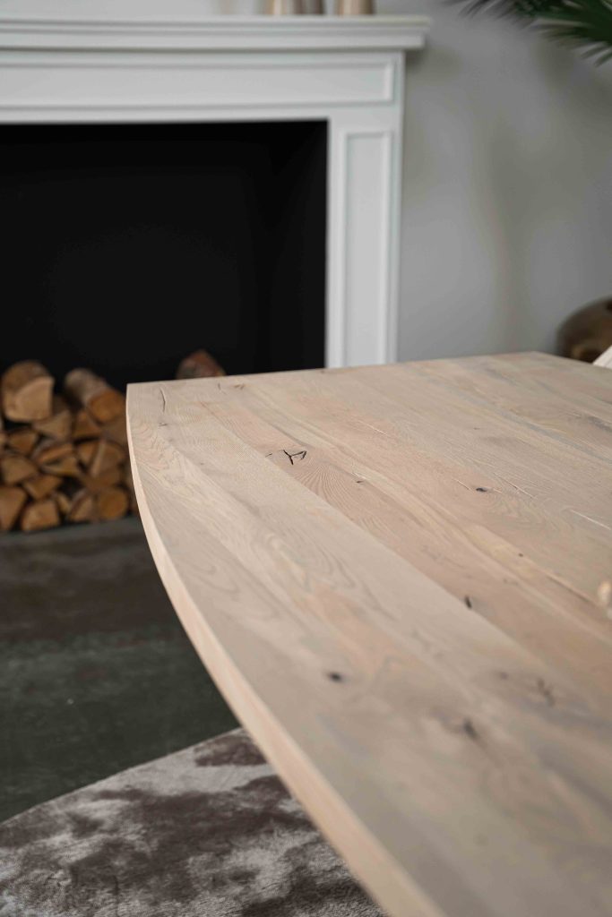 The Nice semi-oval dining table with a tapered spider leg from Room108