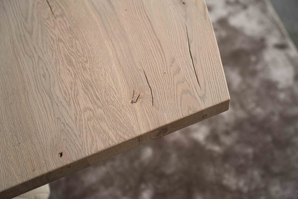 The Nice semi-oval dining table with a tapered spider leg from Room108