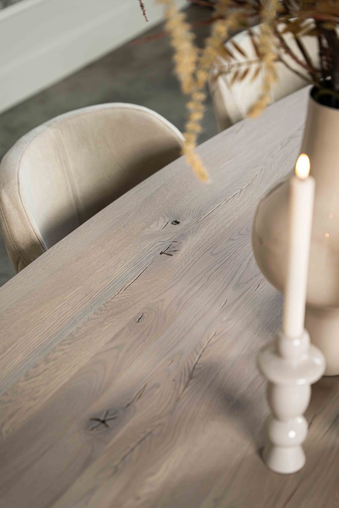 The Nice semi-oval dining table with a tapered spider leg from Room108