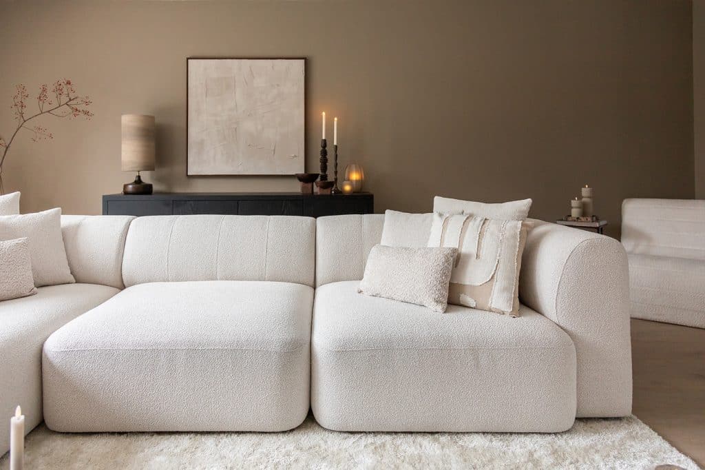 Beige corner sofa with round shapes in a Japandi interior. Inside look at Jenny.
